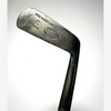 Cleek mark on the Gibson Monel Special putter reading Made in Scotland with the Kinghorn oval stamp