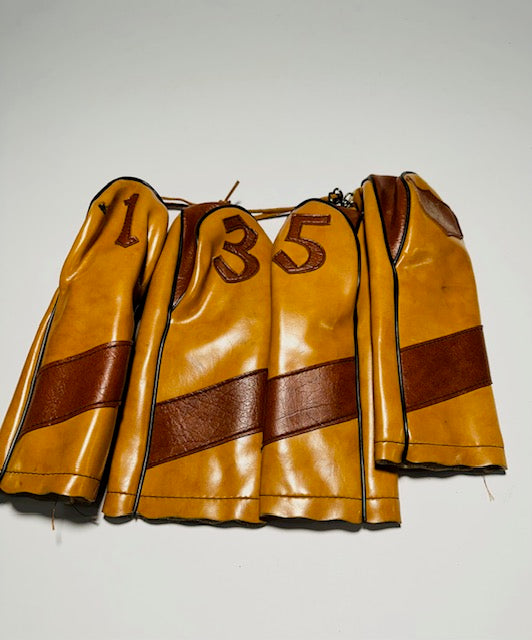 Vintage Lynx tan leather golf headcover set numbered 1, 3, 5 and a blank with brown stripe