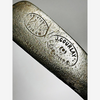 Close-up of the J. Gourlay Carnoustie cleek mark and Sportsman's Emporium retailer stamp on the hickory golf putter