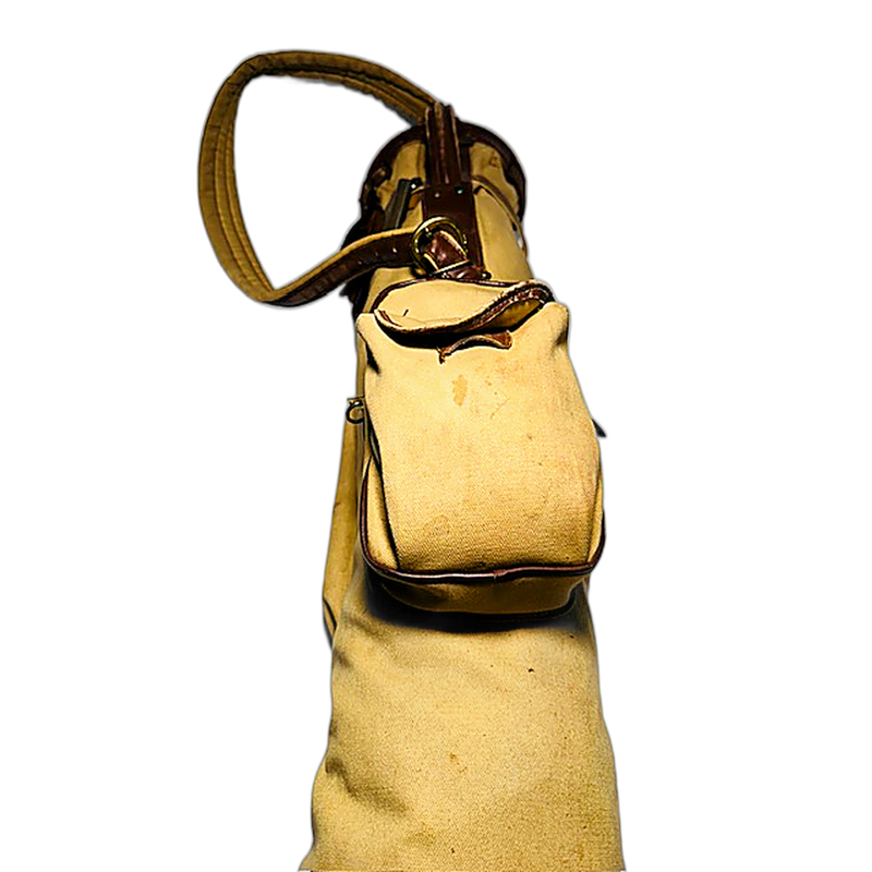 Vintage canvas and leather slouch golf bag standing, hickory golf