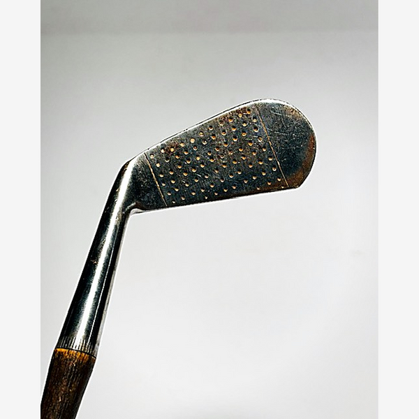 Dot punch face of the Spalding thistle hickory golf mid-iron at address