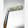 Face of the Gibson Monel Special putter showing dense punched dot scoring, hickory golf