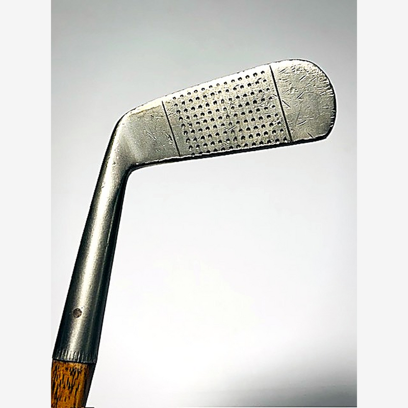 Face of the Gibson Monel Special putter showing dense punched dot scoring, hickory golf