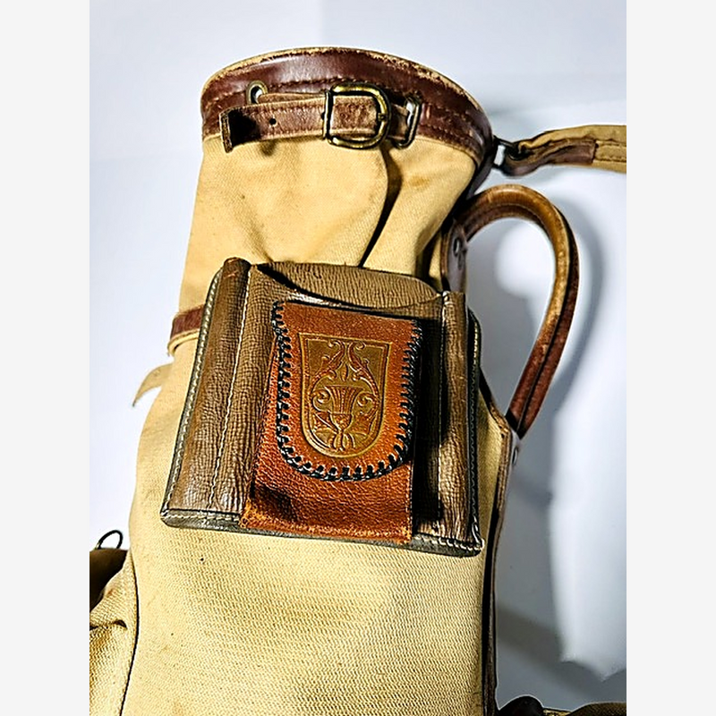 Embossed leather crest badge on vintage golf bag