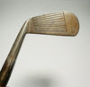 Thomas E. Wilson mid iron hickory golf face with scored lines at address