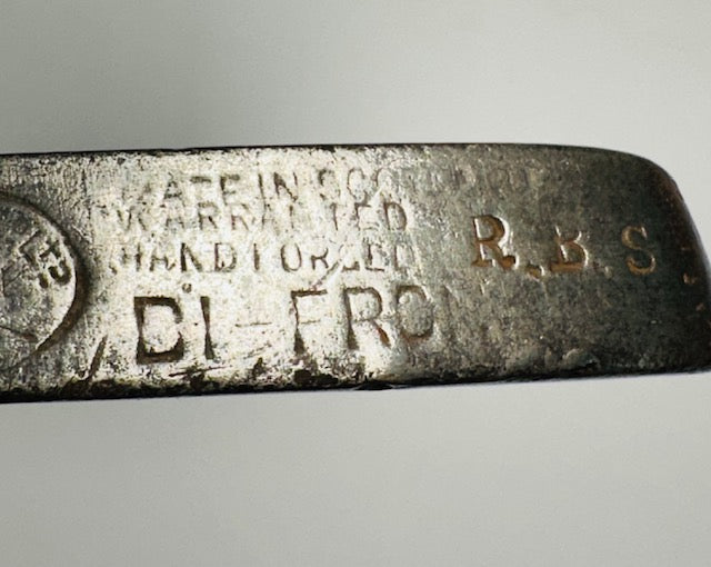 Close up of Gibson made in Scotland hand forged head stamping