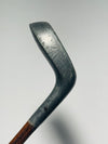 Aluminum putter head profile and hosel showing antique patina