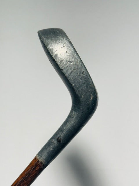 Aluminum putter head profile and hosel showing antique patina