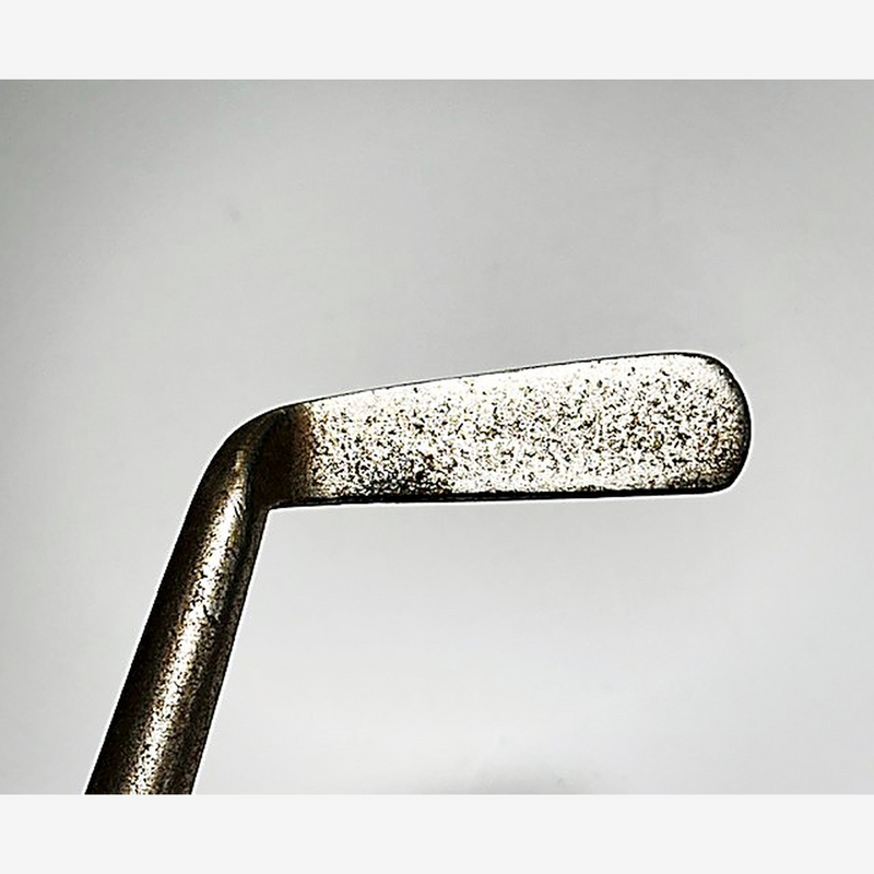 Smooth face of the J. Gourlay hickory golf putter shown at address
