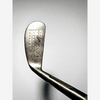 Face of the MacGregor Bobbie iron showing punched dot and line scoring, hickory golf