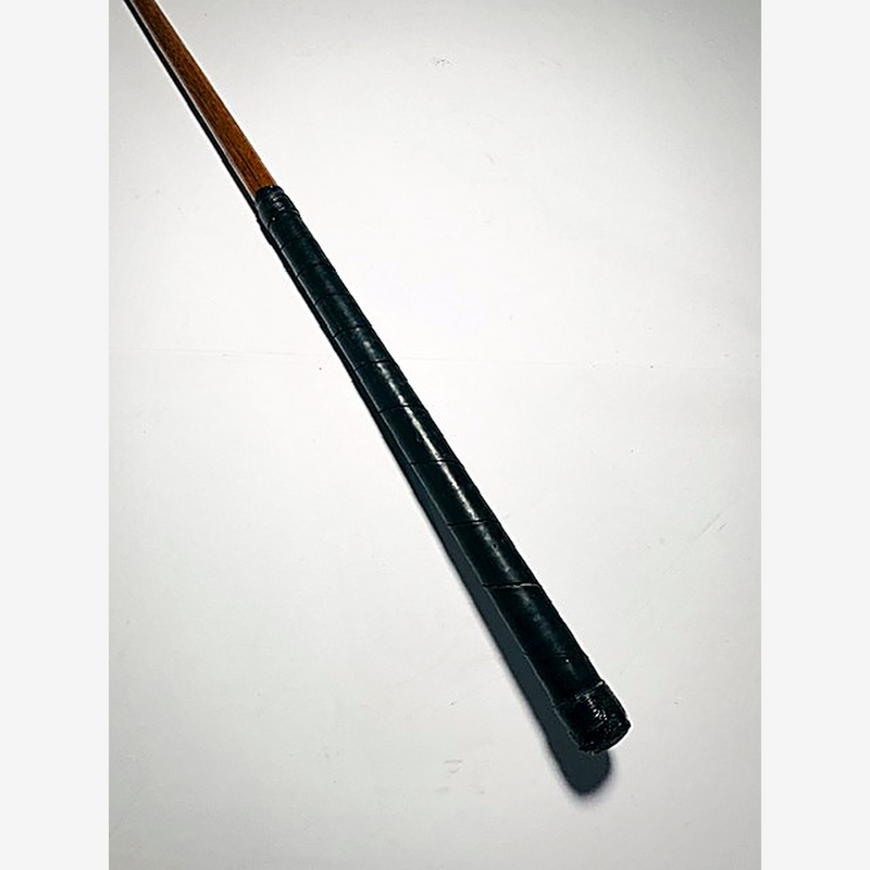 Dark leather wrap grip on the A. Patrick Leven ladies hickory golf niblick