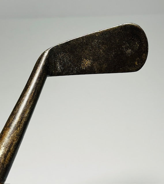 Smooth-face hickory iron head showing honest gutty-era wear