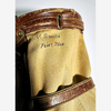 Studded leather base of vintage canvas golf bag