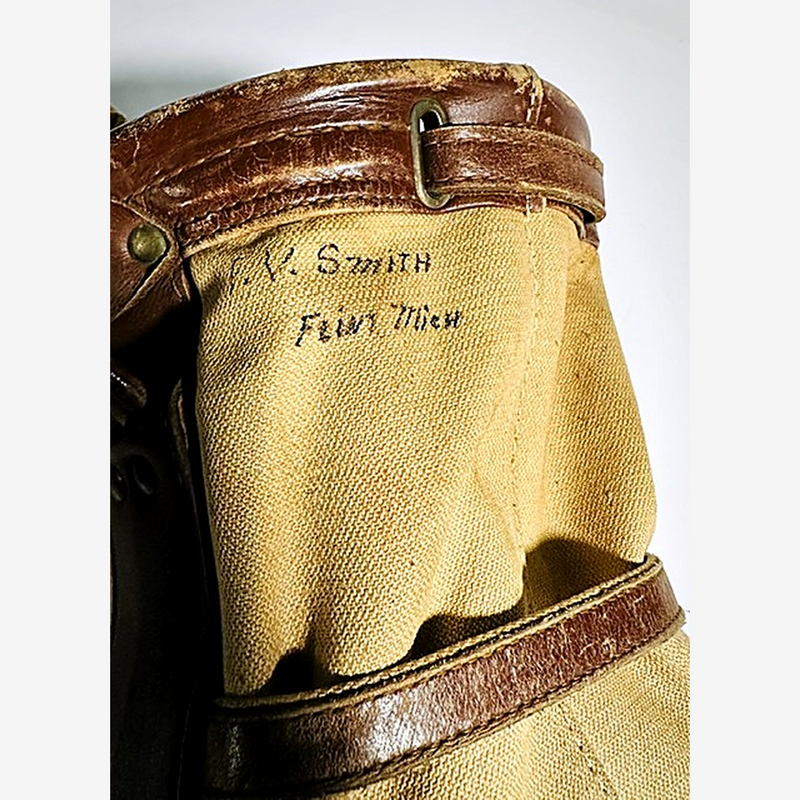 Studded leather base of vintage canvas golf bag